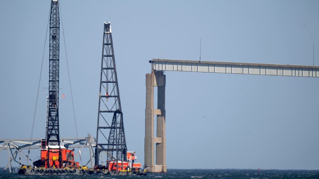 Crews cautiously begin extracting initial section of mangled steel from Baltimore bridge collapse